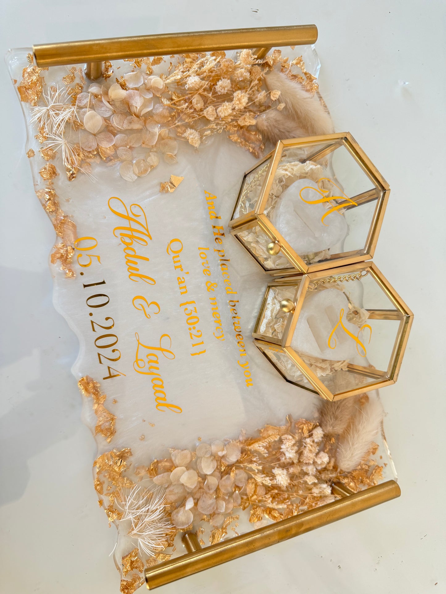 White and beige dried flowered ring tray