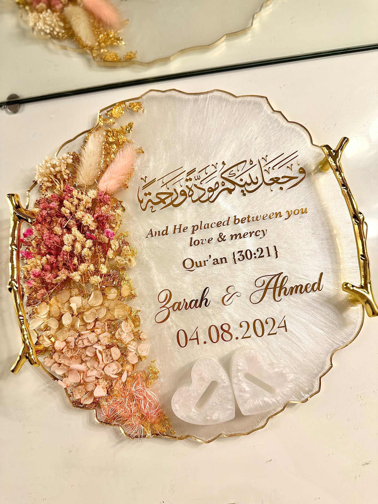 Dried pastel pink and gold ring tray